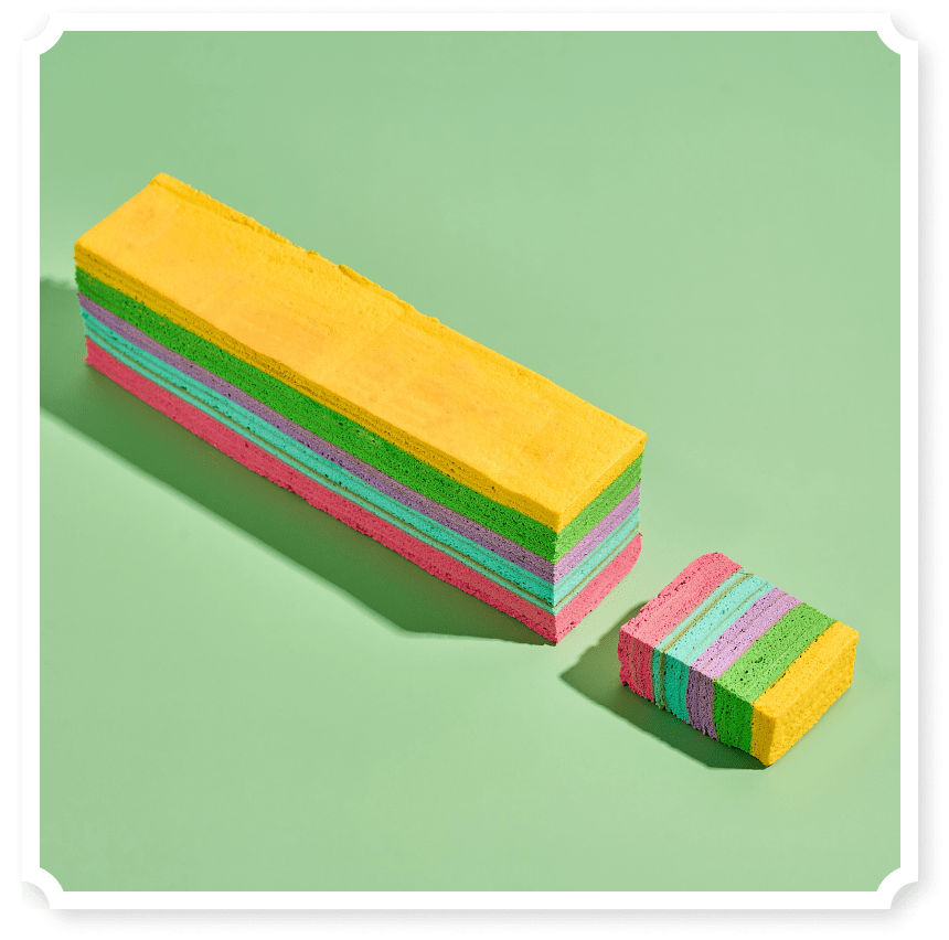 chempiyen (strawberry, Blueberry & Cheese) distinct, even layers in yellow, green, pink, purple, and blue, arranged in a repeating pattern