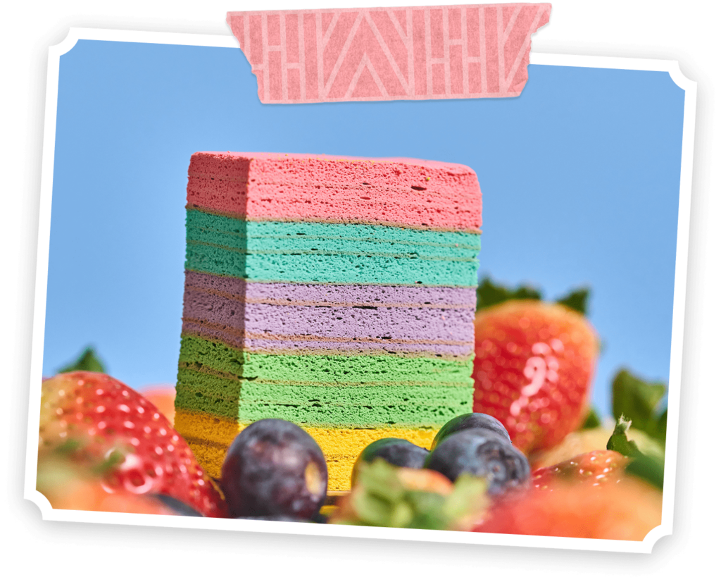 chempiyen lapis (strawberry, Blueberry & Cheese) distinct, even layers in yellow, green, pink, purple, and blue